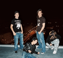 a group of young men are posing for a picture with one wearing a shirt that says social distortion