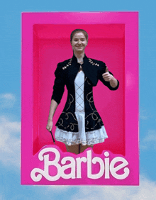 a picture of a woman in a pink barbie box