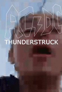 an ad for ac dc thunderstruck with a man 's face in the background