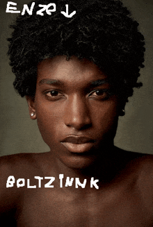 a close up of a man 's face with the name boltz ink written on it