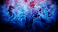 a blue and red smoke coming out of a hole