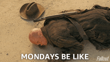 a man laying on the ground next to a cowboy hat and a rifle with the words monday 's be like below him