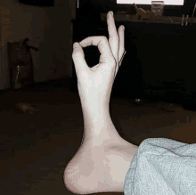 a person 's foot is making a ok sign