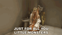 a woman sitting on a toilet with the words just for all you little monsters