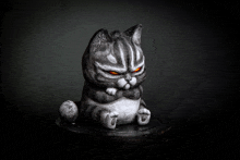 a statue of a cat with orange eyes is sitting on a table