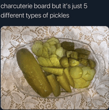 a plate of pickles with the caption " charcuterie board but it 's just 5 different types of pickles " on the bottom