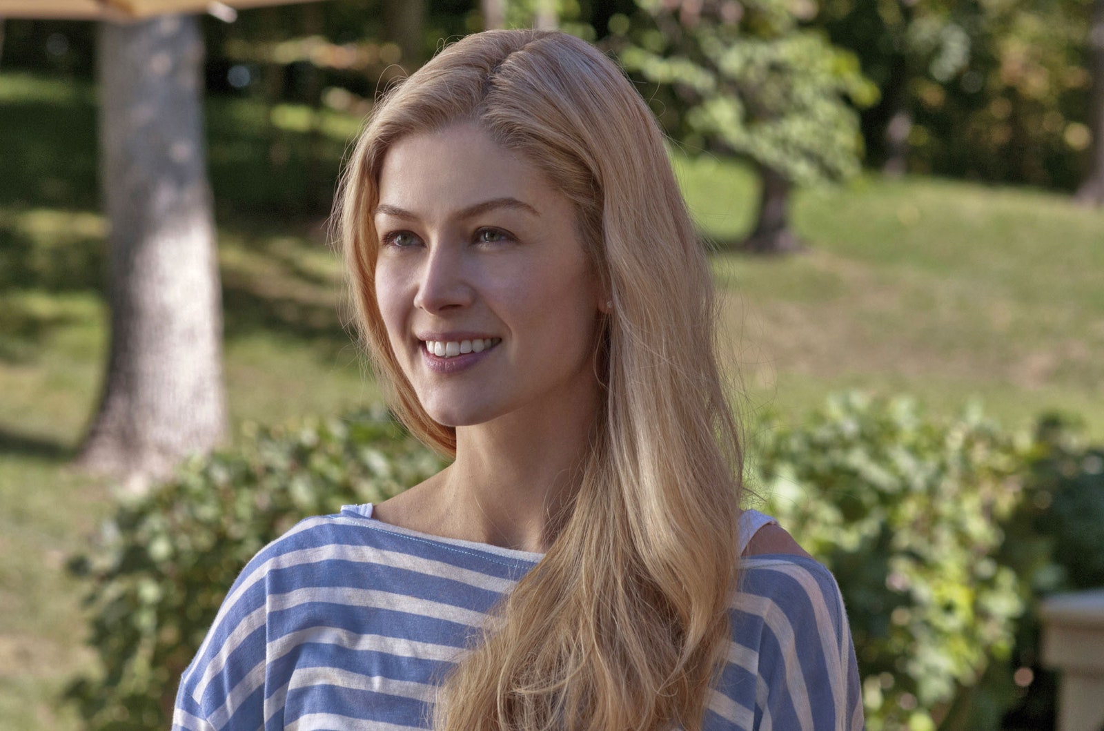 Image may contain Rosamund Pike Blonde Hair Person Teen Face Happy Head Smile Photography Portrait and Body Part