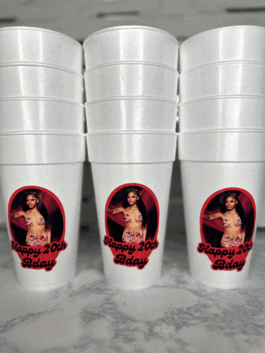 a stack of styrofoam cups with the words happy 20th bday on them