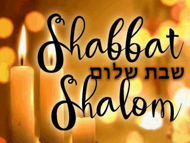 a picture of two lit candles and the words shabbat shalom