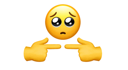 two hands pointing at a smiley face with a sad look on its face