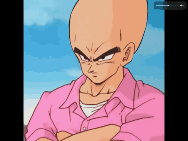 a bald man in a pink shirt with his arms crossed looks angry