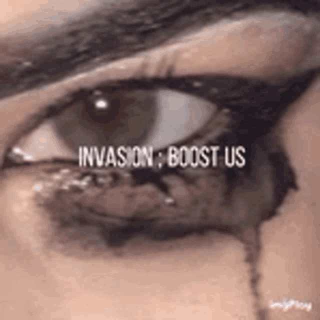 a close up of a woman 's eye with the words `` invasion boost us '' written above it .