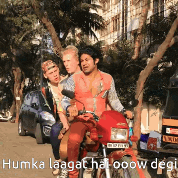 a group of people riding a motorcycle with the words humka laagat hai ooow degi on the bottom