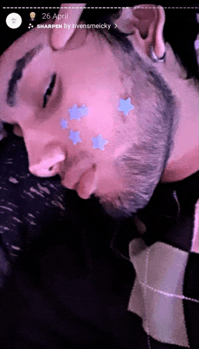 a photo of a man with stars on his face taken on april 26th