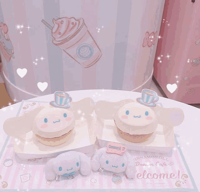 two cinnamoroll cupcakes sit on a table with a welcome mat