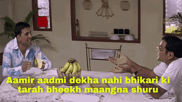 two men are sitting at a table with a bunch of bananas and a caption that says amir aadmi dekha nahi