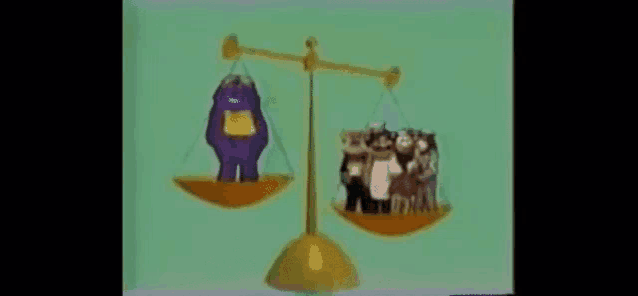 a scale with a purple bear and a group of cartoon characters on it .