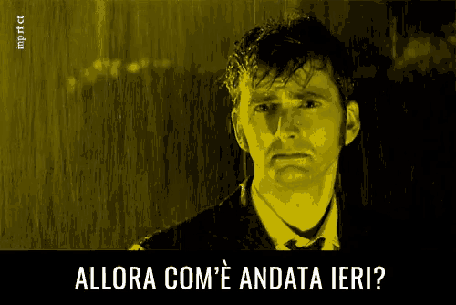 a man in a suit and tie is standing in the rain with the words allora com ' e andata ieri written below him