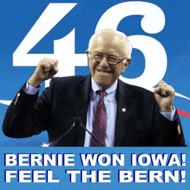 a man in a suit and tie stands in front of a sign that says ' bernie won iowa feel the bern '