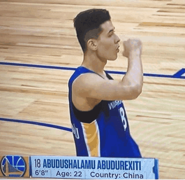 a basketball player with the number 18 on the back of his shirt