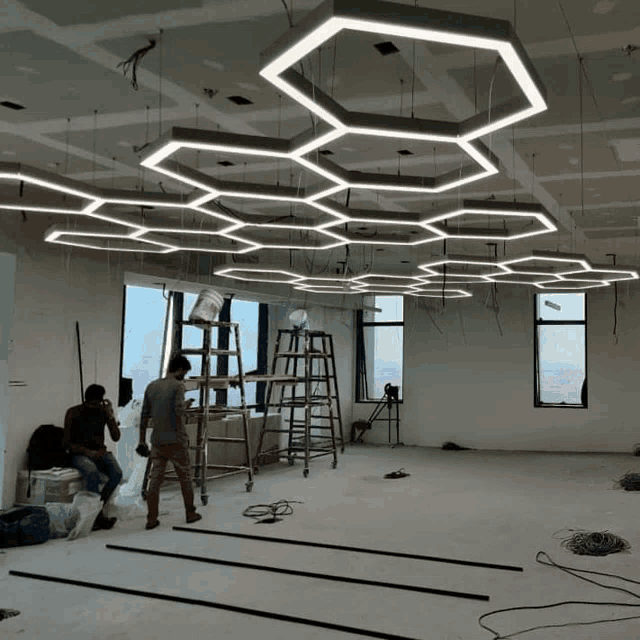 a large room with a ceiling that has a honeycomb design on it