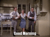 a couple of men and a woman are dancing in a kitchen with the words good morning written on the bottom