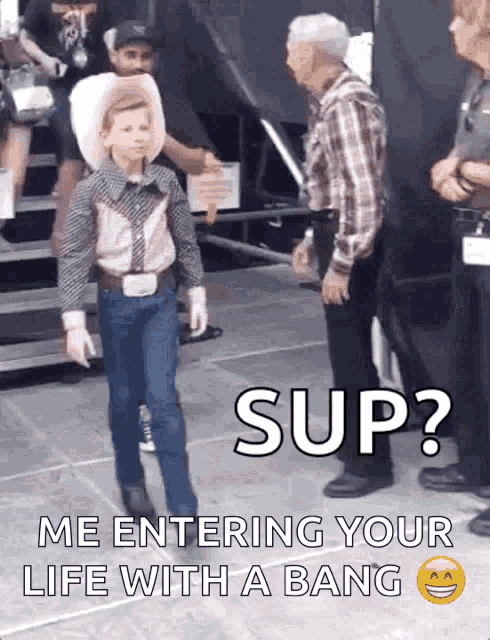 a young boy in a cowboy outfit is standing next to a man in a plaid shirt and says " sup " on the bottom