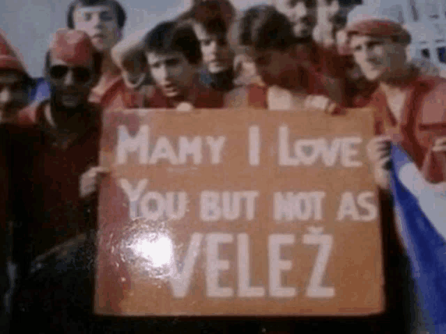 many i love you but not as velez is written on a sign