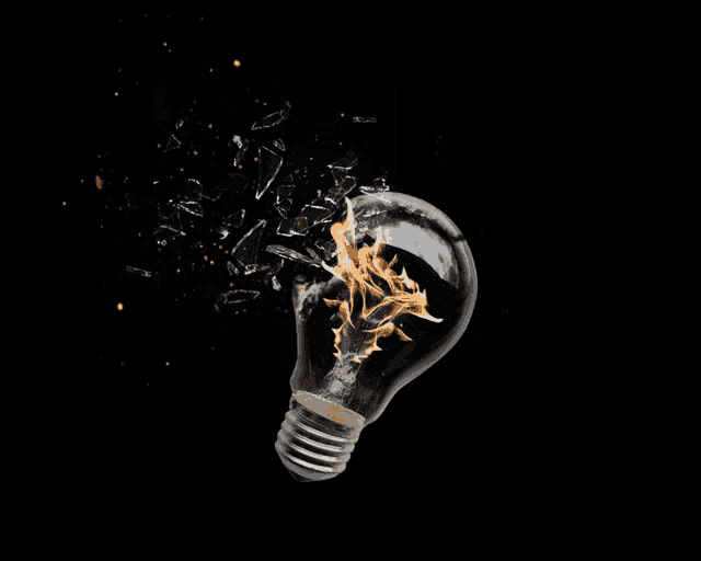 a light bulb is on fire and breaking apart