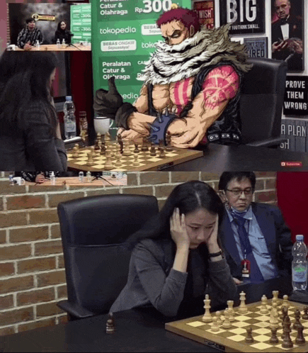 a man and a woman playing chess with a sign that says big in the background