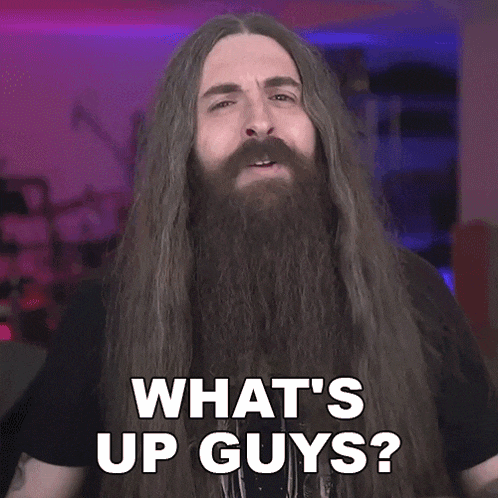 a man with long hair and a beard is asking what 's up guys .