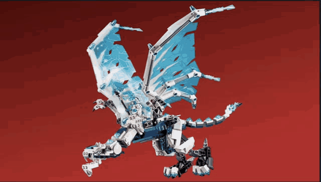 a lego dragon with a red background is flying in the air