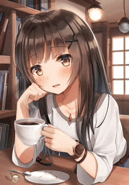 a girl is sitting at a table with a cup of coffee in her hand .