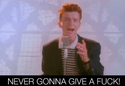 rick astley is singing into a microphone in a video that says `` never gonna give a fuck ! ''