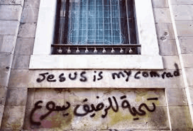 a wall with graffiti on it that says `` jesus is my comrade '' .