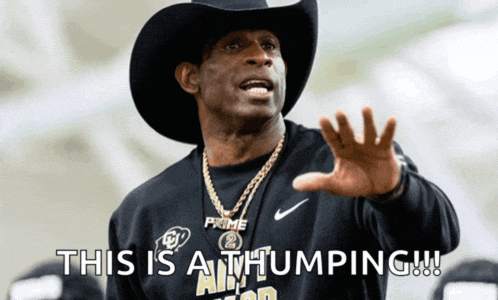 a man wearing a cowboy hat and a shirt that says " this is at thumping "