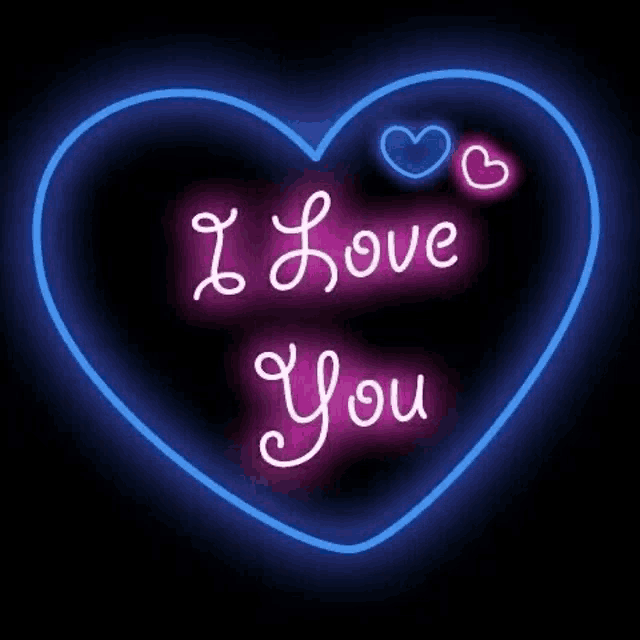 a neon sign that says `` i love you '' in the shape of a heart