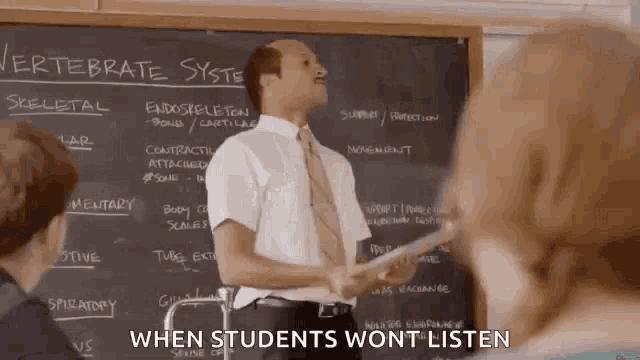 a man is standing in front of a blackboard with the words " when students wont listen " on it