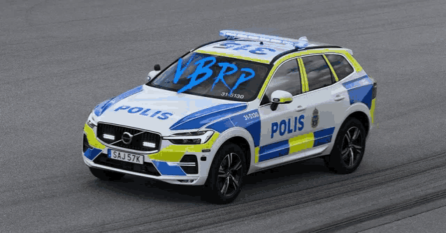 a blue and white volvo police car with the word polis on the side