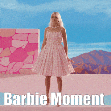 a picture of a woman in a pink dress with the words barbie moment on the bottom