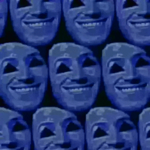 a bunch of blue masks are lined up in a row and smiling .