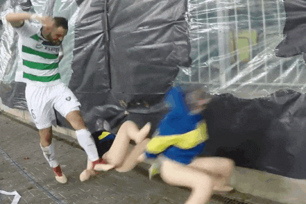 a soccer player with the number 6 on his jersey kicks a mannequin