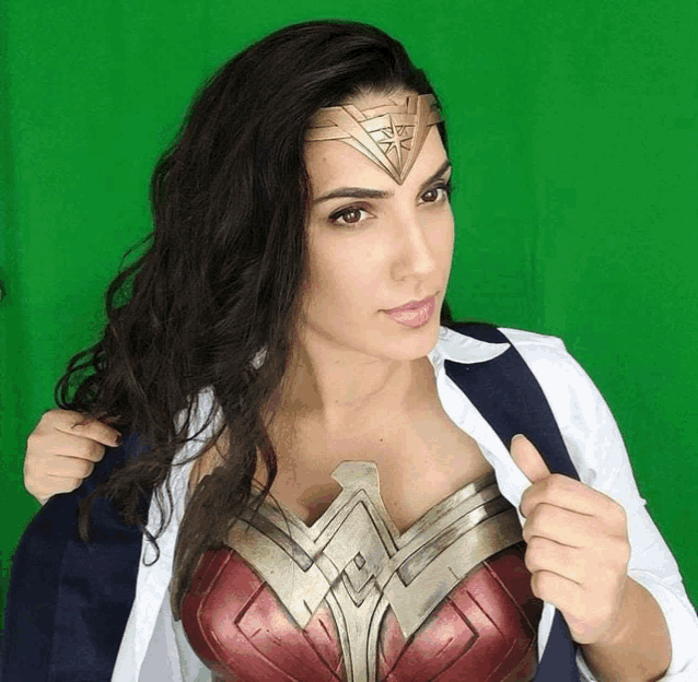 a woman is wearing a wonder woman costume and a headband