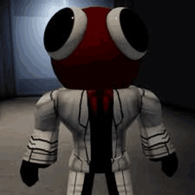 a red and white stuffed animal with big eyes and a white jacket is standing in a room .