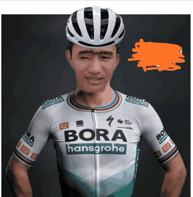 a man wearing a white helmet and a bora hansgrohe jersey