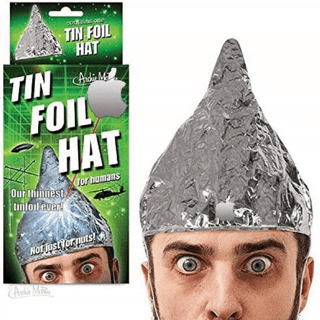 a man wearing a tin foil hat next to a box