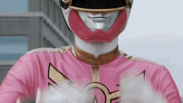 a close up of a power ranger in a pink and white outfit