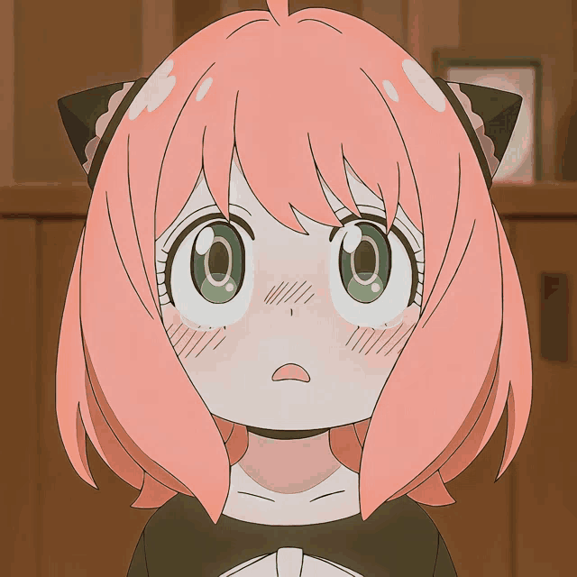 a girl with pink hair and green eyes has a cat ear