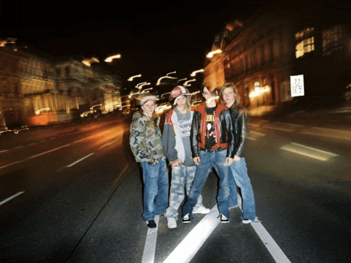 a group of people standing on the side of a street with a sign that says ' a / s ' on it