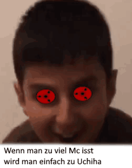 a close up of a child 's face with red eyes